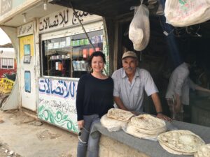 Man and woman at bakery food stall